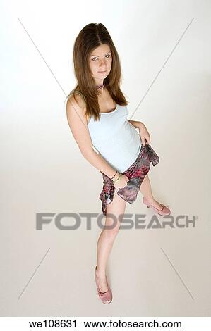 Teenage girl posing on a white background View Large Photo Image Stock Image - Teenage girl posing on a white background. Fotosearch