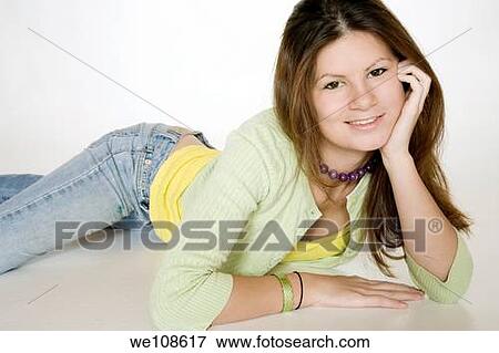 Teenage girl posing on a white background View Large Photo Image Stock Photo - Teenage girl posing on a white background. Fotosearch