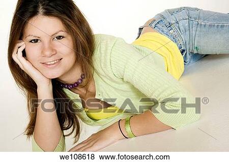 Teenage girl posing on a white background View Large Photo Image Stock Photo - Teenage girl posing on a white background. Fotosearch