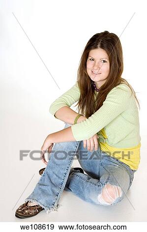 Teenage girl posing on a white background View Large Photo Image Stock Photo - Teenage girl posing on a white background. Fotosearch