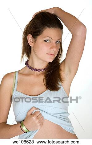 Teenage girl posing on a white background View Large Photo Image Stock Photo - Teenage girl posing on a white background. Fotosearch