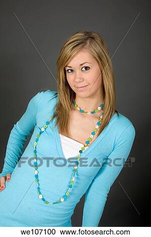 Teenage girl posing on gray background with some attitude View Large Photo Image Stock Image - Teenage girl posing on gray background with some attitude. Fotosearch