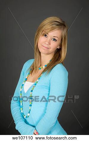 Teenage girl posing on gray background with some attitude View Large Photo Image Stock Image - Teenage girl posing on gray background with some attitude. Fotosearch