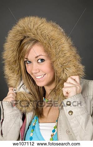 Teenage girl posing on gray background with some attitude View Large Photo Image Stock Image - Teenage girl posing on gray background with some attitude. Fotosearch