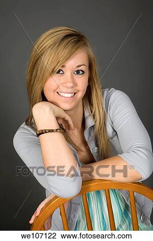 Teenage girl posing on gray background with some attitude View Large Photo Image Stock Image - Teenage girl posing on gray background with some attitude. Fotosearch