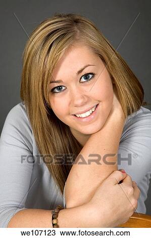 Teenage girl posing on gray background with some attitude View Large Photo Image Stock Image - Teenage girl posing on gray background with some attitude. Fotosearch