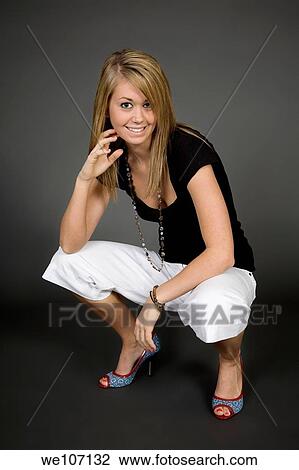 Teenage girl posing on gray background with some attitude View Large Photo Image Stock Image - Teenage girl posing on gray background with some attitude. Fotosearch