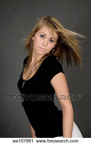 Teenage girl posing on gray background with some attitude View Large Photo Image Stock Image - Teenage girl posing on gray background with some attitude. Fotosearch