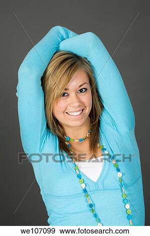 Teenage girl posing on gray background with some attitude View Large Photo Image Stock Photo - Teenage girl posing on gray background with some attitude. Fotosearch
