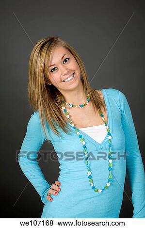 Teenage girl posing on gray background with some attitude View Large Photo Image Stock Photo - Teenage girl posing on gray background with some attitude. Fotosearch