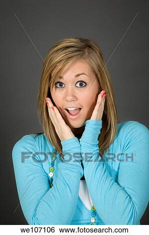 Teenage girl posing on gray background with some attitude View Large Photo Image Stock Photograph - Teenage girl posing on gray background with some attitude. Fotosearch