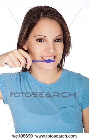 Stock Image - Woman brushing teeth. Fotosearch