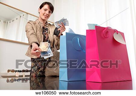 Woman in a clothes shop View Large Photo Image Stock Image - Woman in a clothes shop. Fotosearch