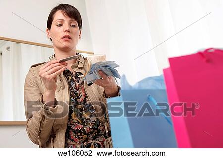 Woman in a clothes shop View Large Photo Image Stock Image - Woman in a clothes shop. Fotosearch