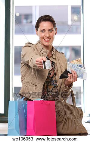 Woman in a clothes shop View Large Photo Image Stock Image - Woman in a clothes shop. Fotosearch