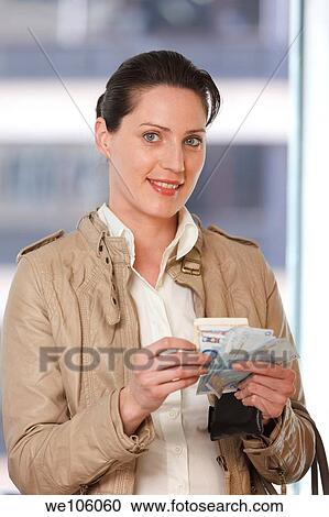 Woman in a clothes shop View Large Photo Image Stock Image - Woman in a clothes shop. Fotosearch