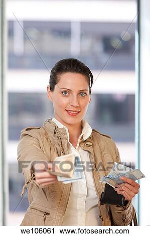 Woman in a clothes shop View Large Photo Image Stock Image - Woman in a clothes shop. Fotosearch