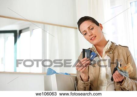 Woman in a clothes shop View Large Photo Image Stock Image - Woman in a clothes shop. Fotosearch