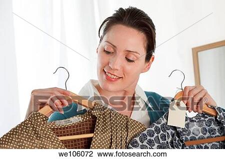 Woman in a clothes shop View Large Photo Image Stock Image - Woman in a clothes shop. Fotosearch