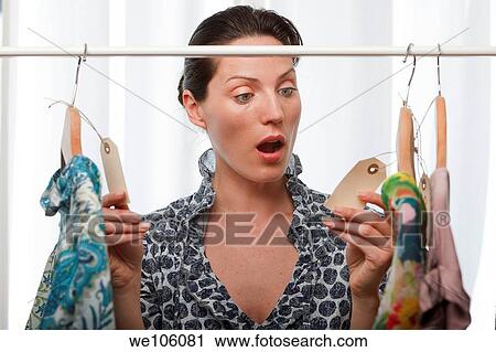 Woman in a clothes shop View Large Photo Image Stock Image - Woman in a clothes shop. Fotosearch