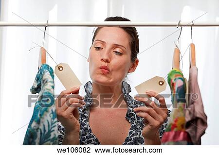 Woman in a clothes shop View Large Photo Image Stock Image - Woman in a clothes shop. Fotosearch