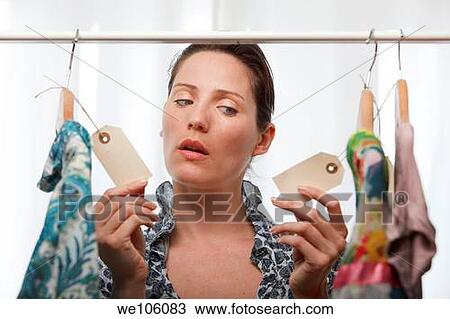 Woman in a clothes shop View Large Photo Image Stock Image - Woman in a clothes shop. Fotosearch