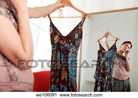 Woman in a clothes shop View Large Photo Image Stock Image - Woman in a clothes shop. Fotosearch