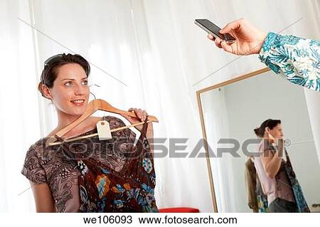 Woman in a clothes shop View Large Photo Image Stock Image - Woman in a clothes shop. Fotosearch
