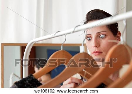 Woman in a clothes shop View Large Photo Image Stock Image - Woman in a clothes shop. Fotosearch