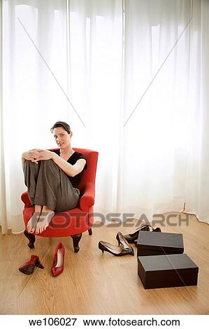 Woman in a clothes shop View Large Photo Image Stock Photo - Woman in a clothes shop. Fotosearch
