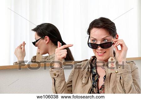 Woman in a clothes shop View Large Photo Image Stock Photo - Woman in a clothes shop. Fotosearch