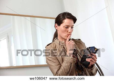 Woman in a clothes shop View Large Photo Image Stock Photo - Woman in a clothes shop. Fotosearch