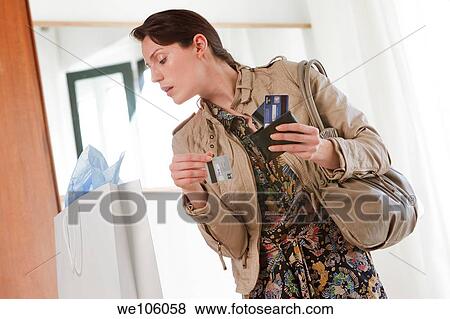 Woman in a clothes shop View Large Photo Image Stock Photo - Woman in a clothes shop. Fotosearch