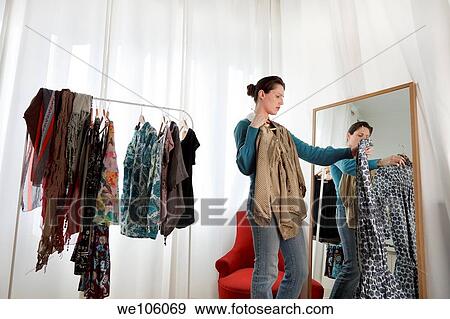 Woman in a clothes shop View Large Photo Image Stock Photo - Woman in a clothes shop. Fotosearch