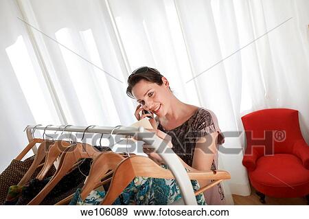 Woman in a clothes shop View Large Photo Image Stock Photo - Woman in a clothes shop. Fotosearch