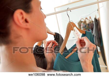 Woman in a clothes shop View Large Photo Image Stock Photo - Woman in a clothes shop. Fotosearch
