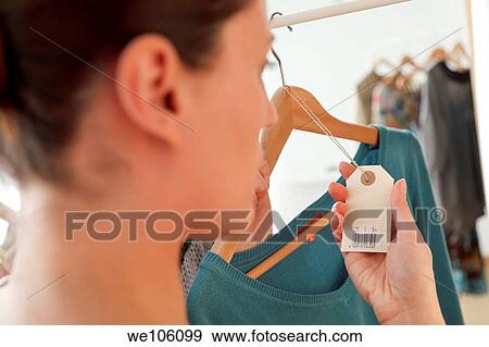 Woman in a clothes shop View Large Photo Image Stock Photo - Woman in a clothes shop. Fotosearch