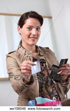 Woman in a clothes shop View Large Photo Image Stock Photograph - Woman in a clothes shop. Fotosearch