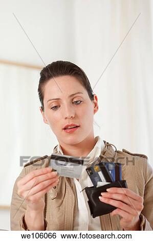 Woman in a clothes shop View Large Photo Image Stock Photograph - Woman in a clothes shop. Fotosearch
