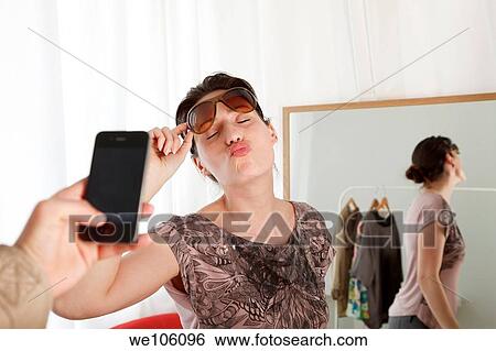 Woman in a clothes shop View Large Photo Image Stock Photograph - Woman in a clothes shop. Fotosearch