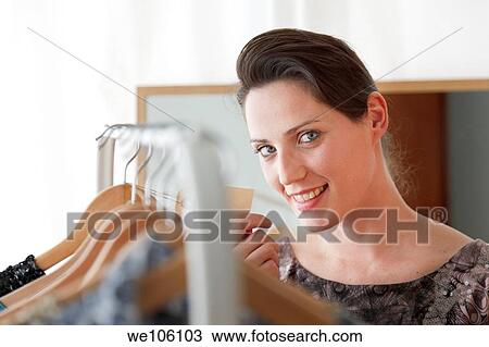 Stock Image - Woman in a fitting room. Fotosearch