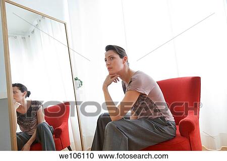 Woman in a fitting room View Large Photo Image Stock Image - Woman in a fitting room. Fotosearch