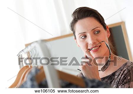 Woman in a fitting room View Large Photo Image Stock Photography - Woman in a fitting room. Fotosearch