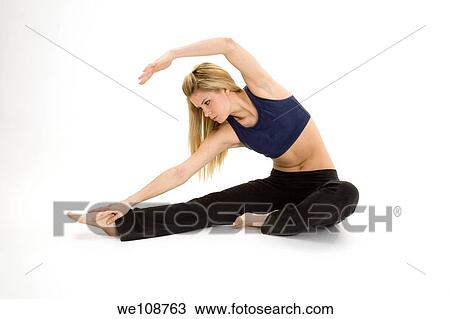 Woman in early 20s practicing yoga meditation View Large Photo Image Stock Image - Woman in early 20s practicing yoga meditation. Fotosearch