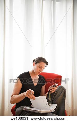 Stock Image - Woman working at home. Fotosearch