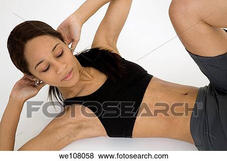 Stock Photo - Young African American woman working out. Fotosearch