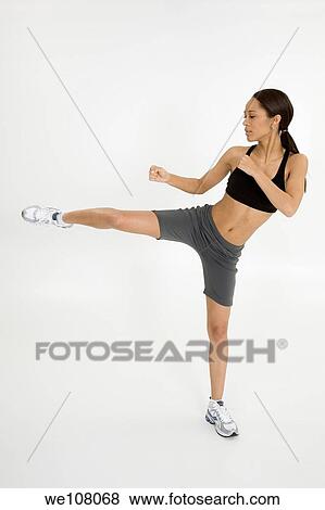 Stock Photo - Young African American woman working out. Fotosearch