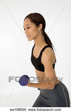 Stock Photography - Young African American woman working out. Fotosearch