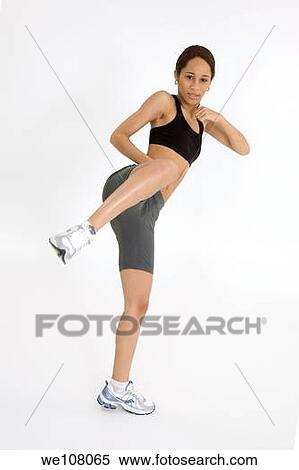 Stock Photography - Young African American woman working out. Fotosearch