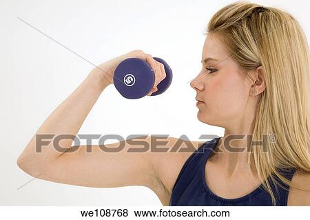 Young caucasian woman working out View Large Photo Image Stock Photo - Young caucasian woman working out. Fotosearch